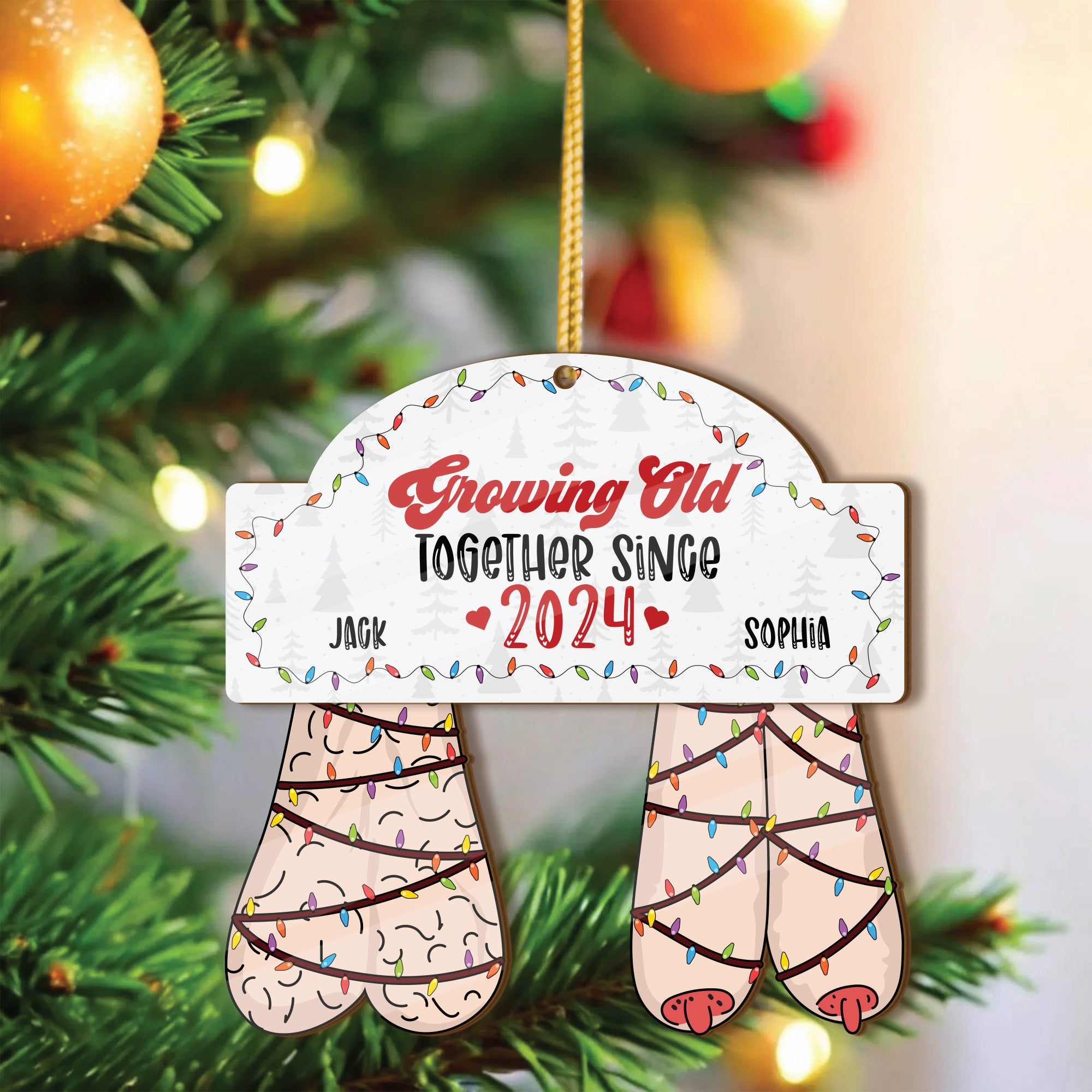 Swaying couple ornament with interactive shake me feature showing moving bottom charms on a Christmas tree