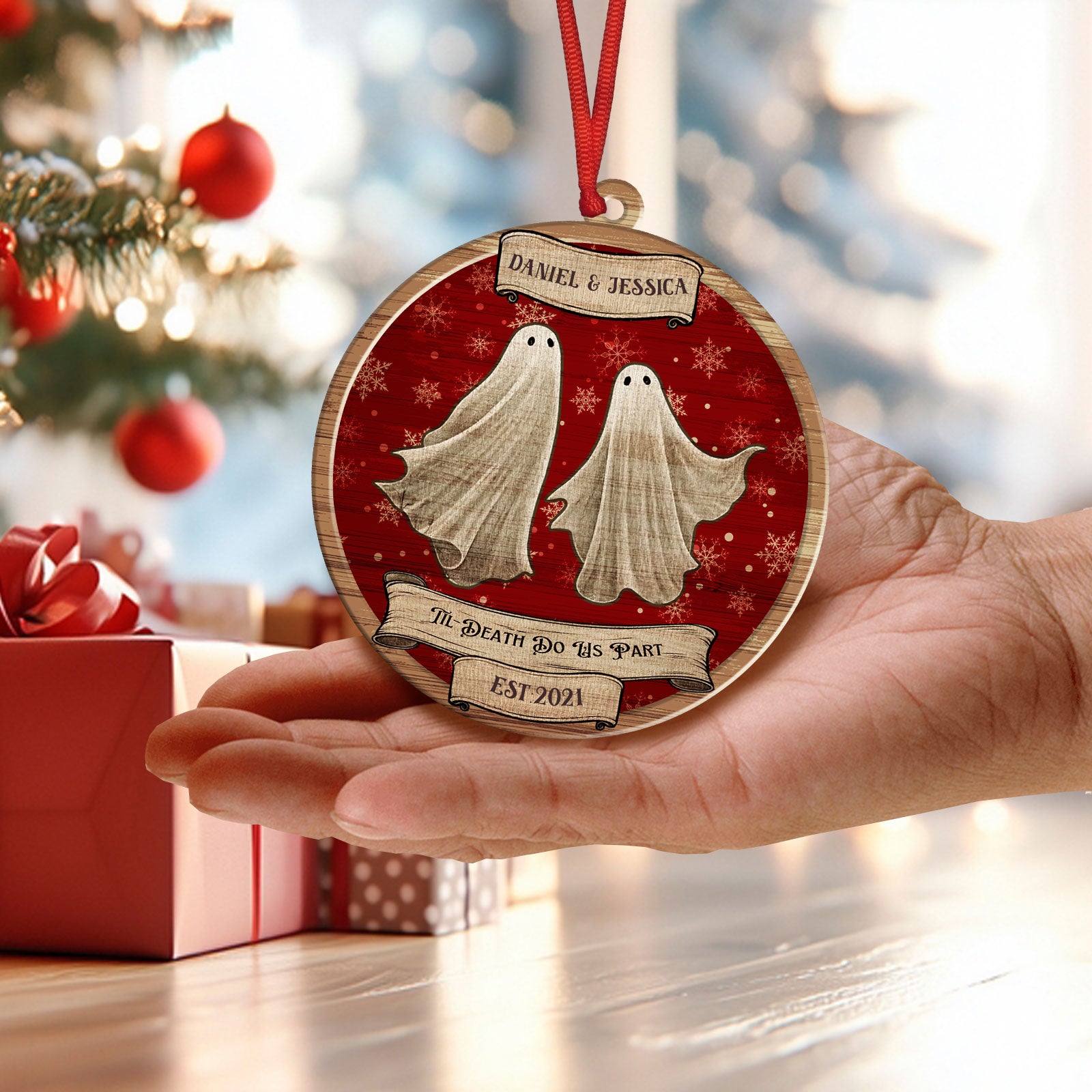 Hand holding a custom wooden ghost ornament showing the lightweight design and vibrant UV printing